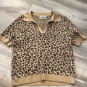 Knit cheetah print shirtsleeve sweater.